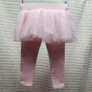 Pink, stretch pants w/ a fluffy skirt as a one piece.